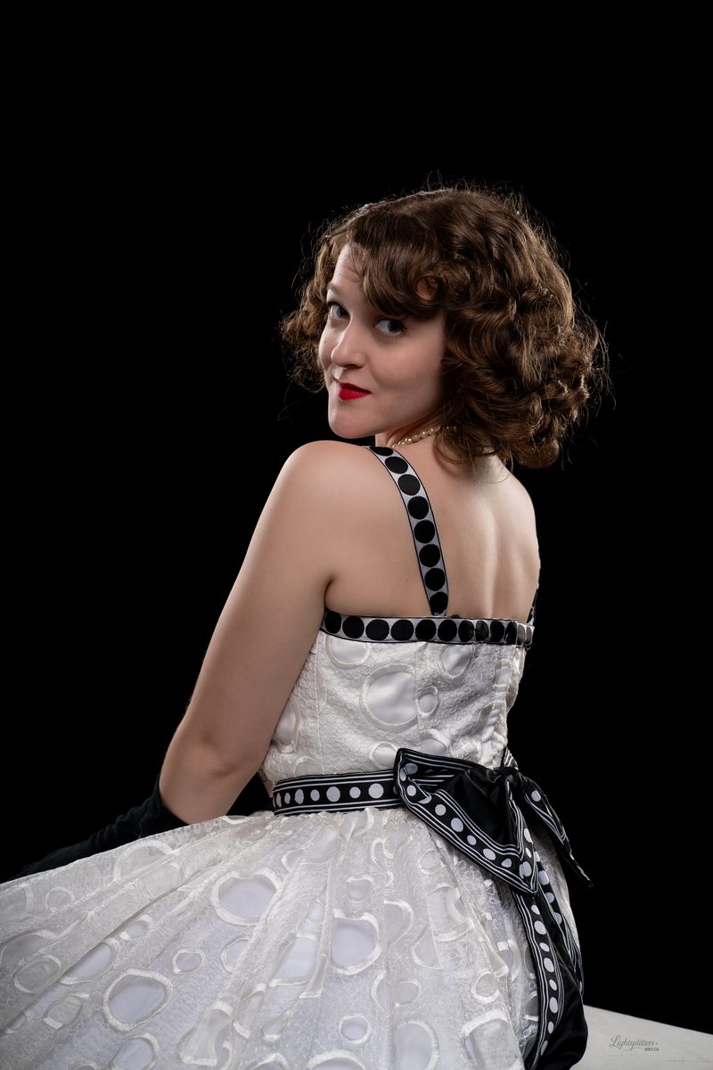 Vintage-styled portrait of a woman looking over her shoulder